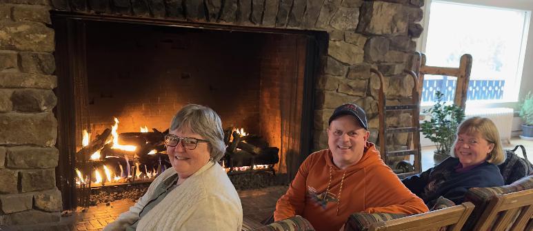 Trio In Front of the Fire at Glacier2